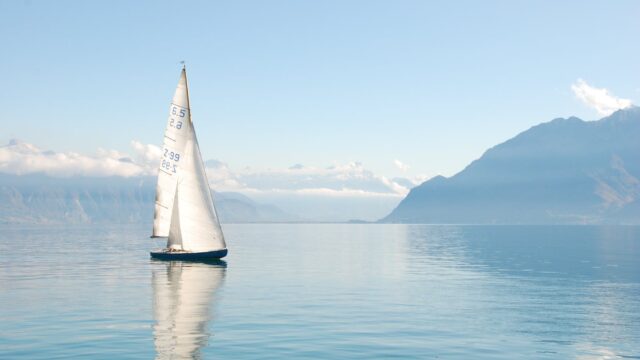 white sailboat on water