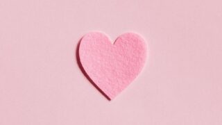 paper heart on light pink background