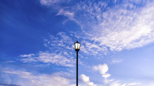 Blue sky background, light pole
